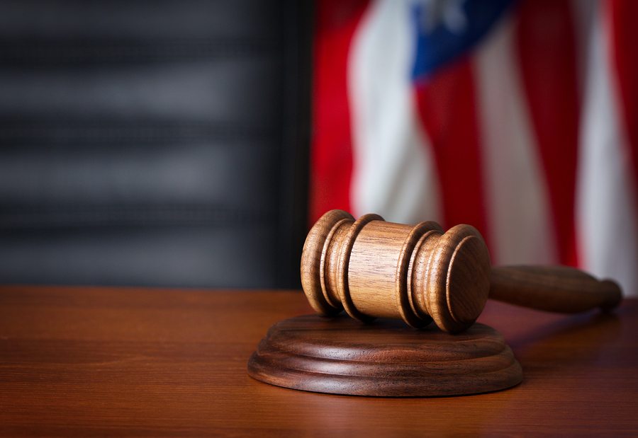 gavel on desk with flag in background